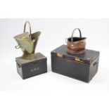 A brass embossed helmet-shaped coal scuttle; a copper coal scuttle; & two storage boxes.