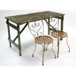 A pair of white painted wrought-iron patio chairs; & a green painted wooden trestle table, 53¾” long