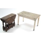 An oak oval gate-leg occasional table on baluster-turned legs & turned feet with plain stretchers,