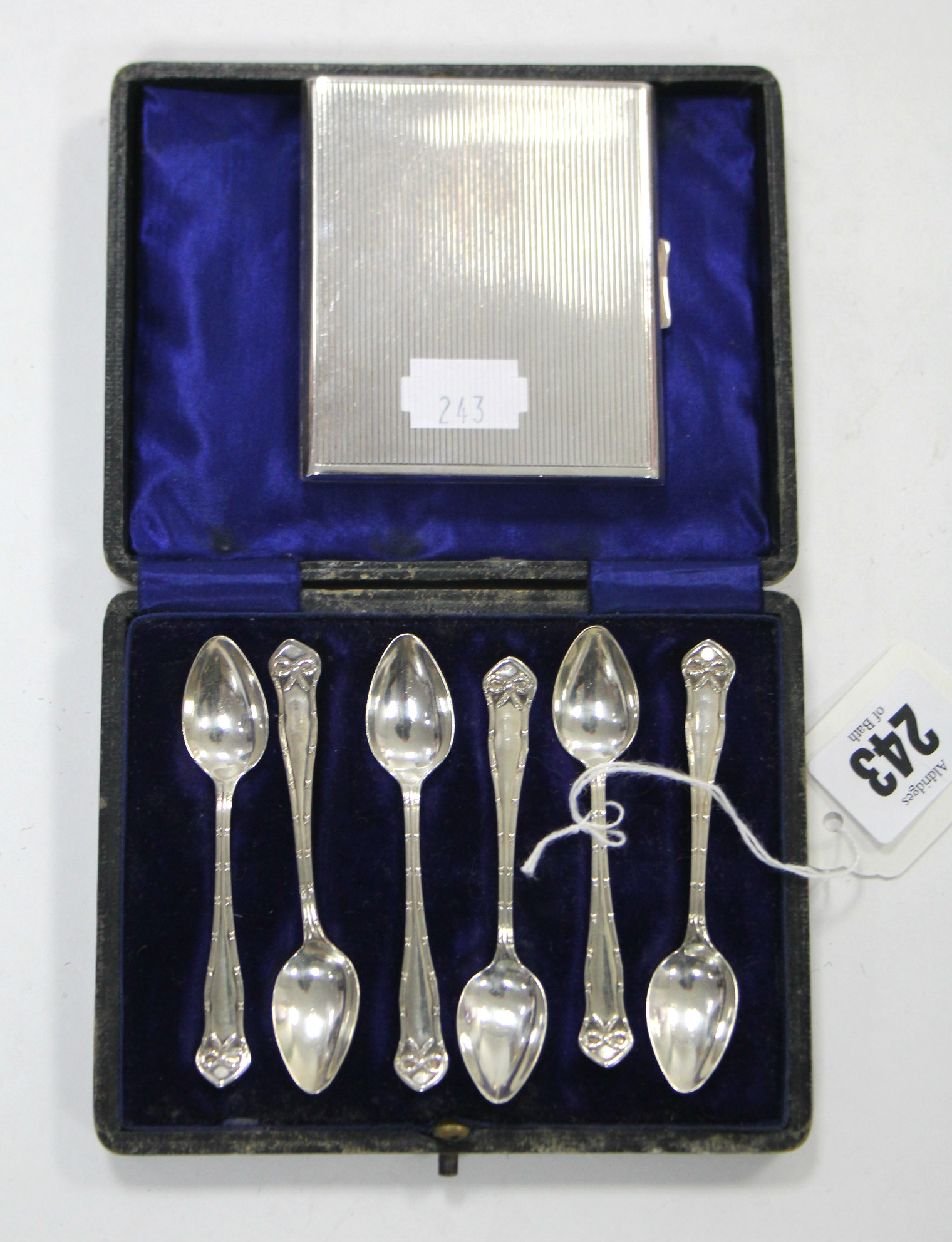 A set of six Edwardian silver coffee spoons, Birmingham 1904, cased; & a George V silver engine-