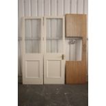 A pair of white painted wooden frame interior doors, each inset glazed panel to top, 24½” wide x