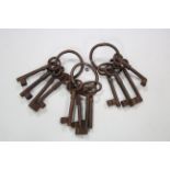 Three sets of reproduction large iron keys.