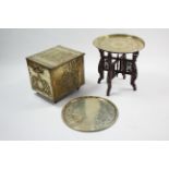 An eastern brass-engraved circular tray-top occasional table on pierced & carved hardwood folding