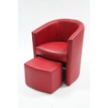 A crimson leatherette tub-shaped chair & foot rest.