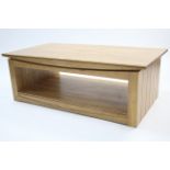 A light oak large rectangular two-tier coffee table, 51” x 27½”.