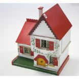 A mid-20th century painted wood small two-storey cottage-style dolls house, with opening front,