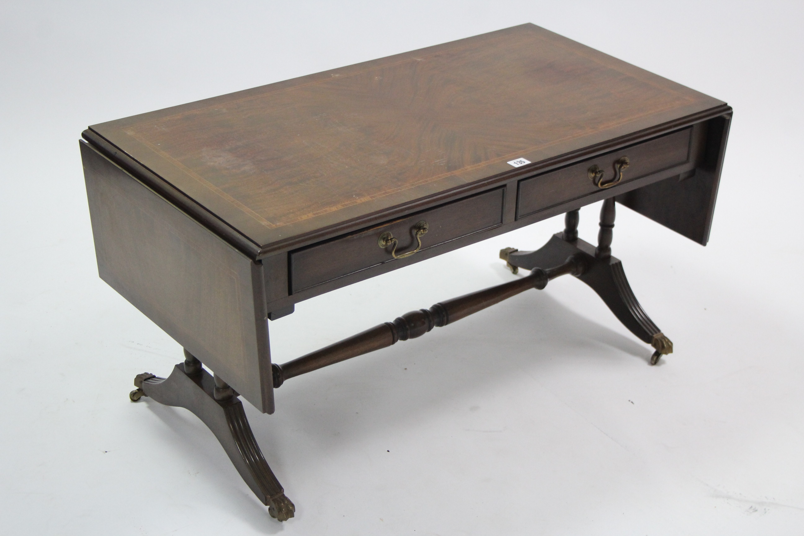 A reproduction inlaid-mahogany sofa-style drop-leaf low coffee table fitted two frieze drawers, & on