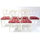 A matched set of eight early Victorian dining chairs with padded drop-in seats upholstered crimson