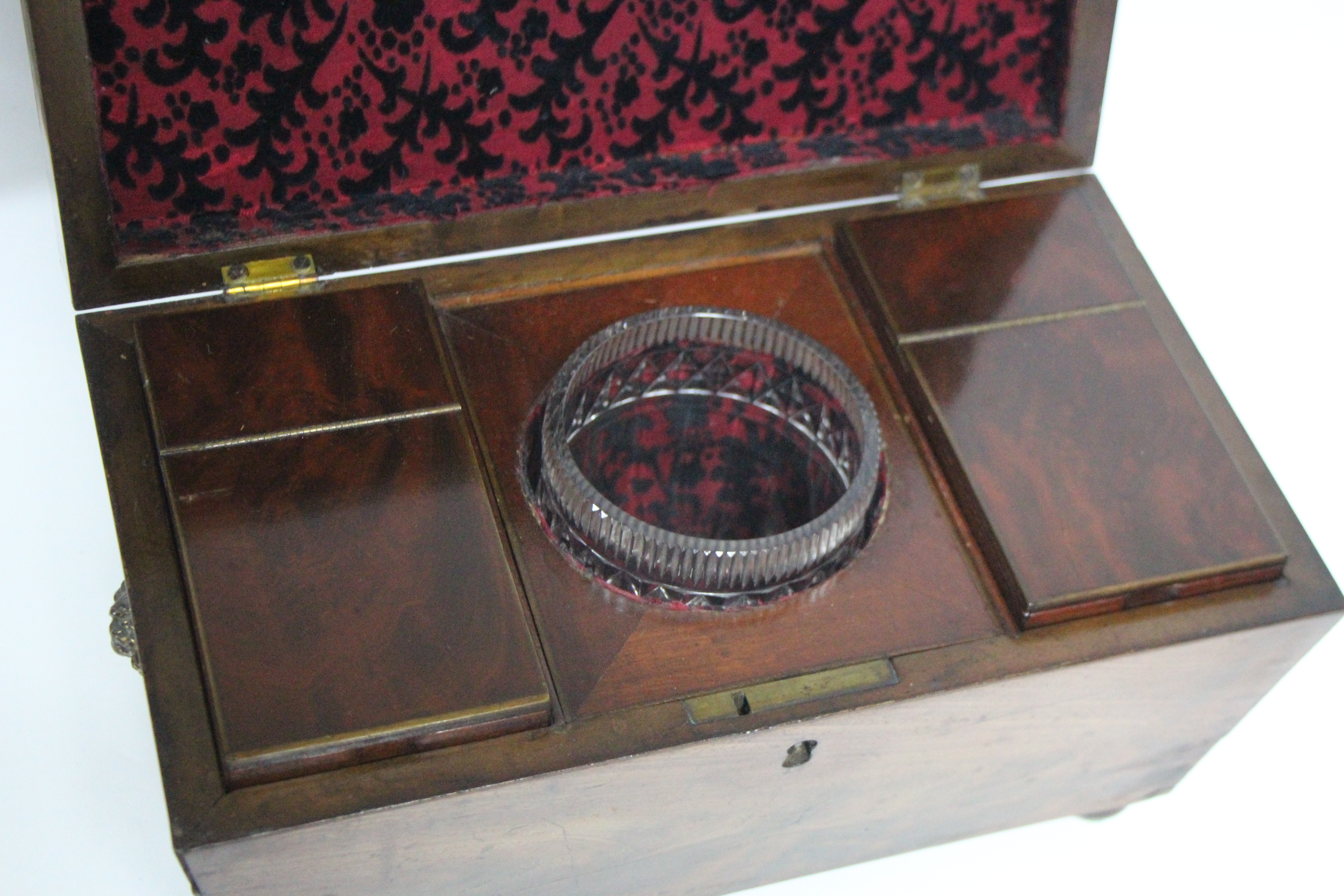 A regency figured mahogany rectangular tea caddy with tapered sides, brass lion-mask & ring side - Image 3 of 5