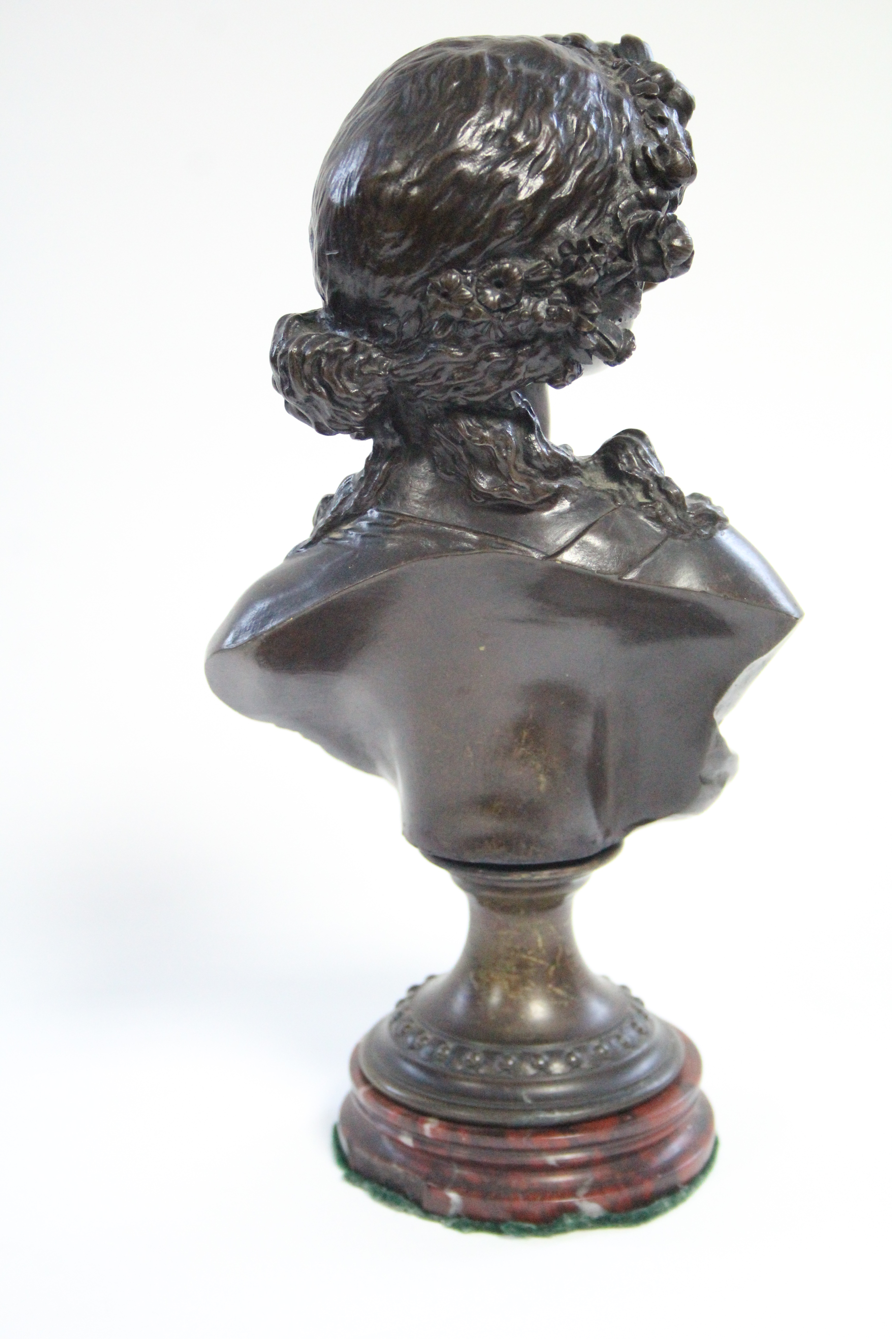 A 19th century bronze bust of a young woman with floral garland in her hair, on round socle & - Image 4 of 4