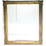 A 19th century gilt gesso large rectangular picture frame; internal measurements: 59” x 52”.