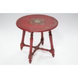 19th century painted beech circular occasional table with floral decoration on a red ground, on