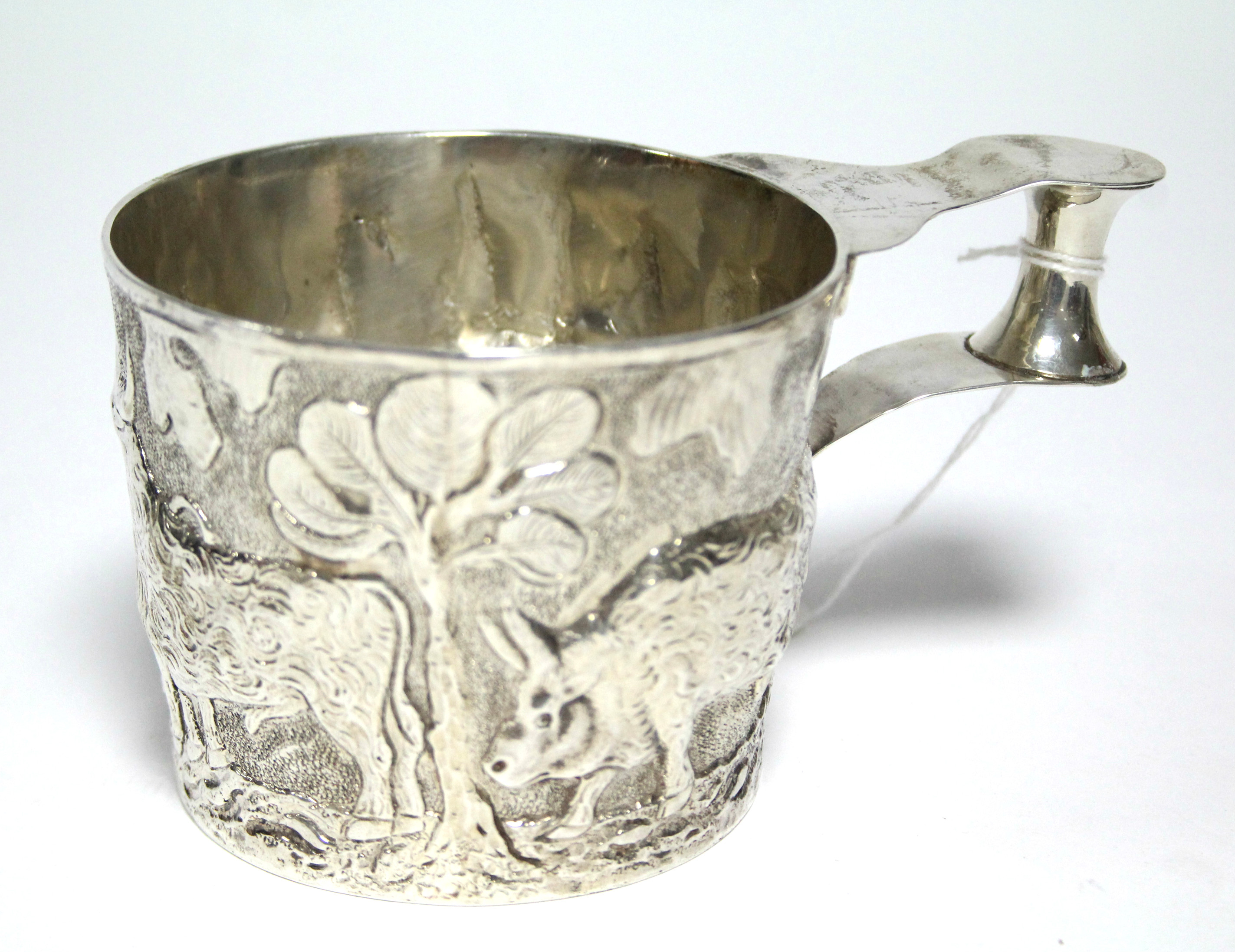 An Edwardian cup in the Etruscan style, of round slightly tapered form, embossed with a continuous