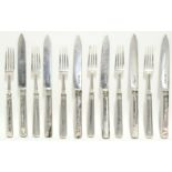 Six pairs of dessert knives & forks with plain loaded handles; the knives & one fork Sheffield 1809,