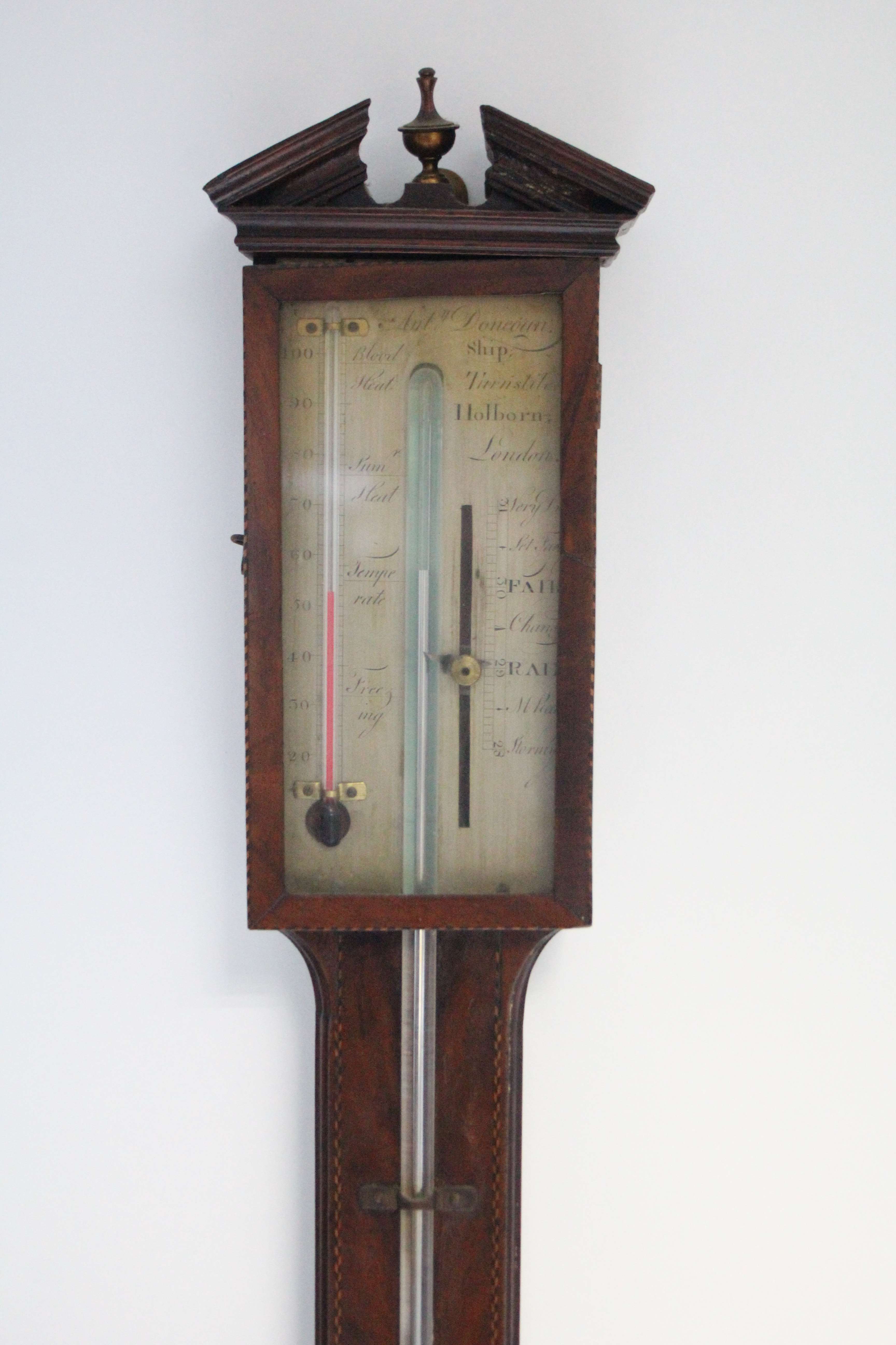 A late George III stick barometer, in mahogany case with inlaid chequered borders, the engraved