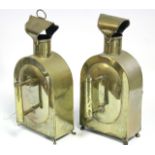 A pair of continental brass hand-held candle lanterns, each with engraved decoration & with domed