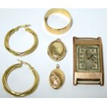 A 9ct. gold plain wedding band; a pair of 9ct. hoop earrings; two small 9ct. oval pendant lockets; &