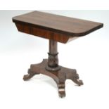 A William IV rosewood tea table with rounded corners to the rectangular fold-over top, on carved