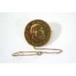 A Dutch gold 10 Guilder coin, Willem III, 1876; converted to a brooch with safety chain.