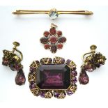 A foil-backed garnet cluster pendant; a 9ct. gold bar brooch set aquamarine; a simulated amethyst