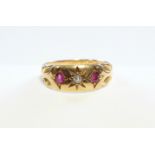 An 18ct. gold ring set diamond & two rubies.