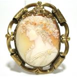 A 19th century carved shell oval cameo brooch depicting the Goddess Flora, 2” x 1½”; in pierced &