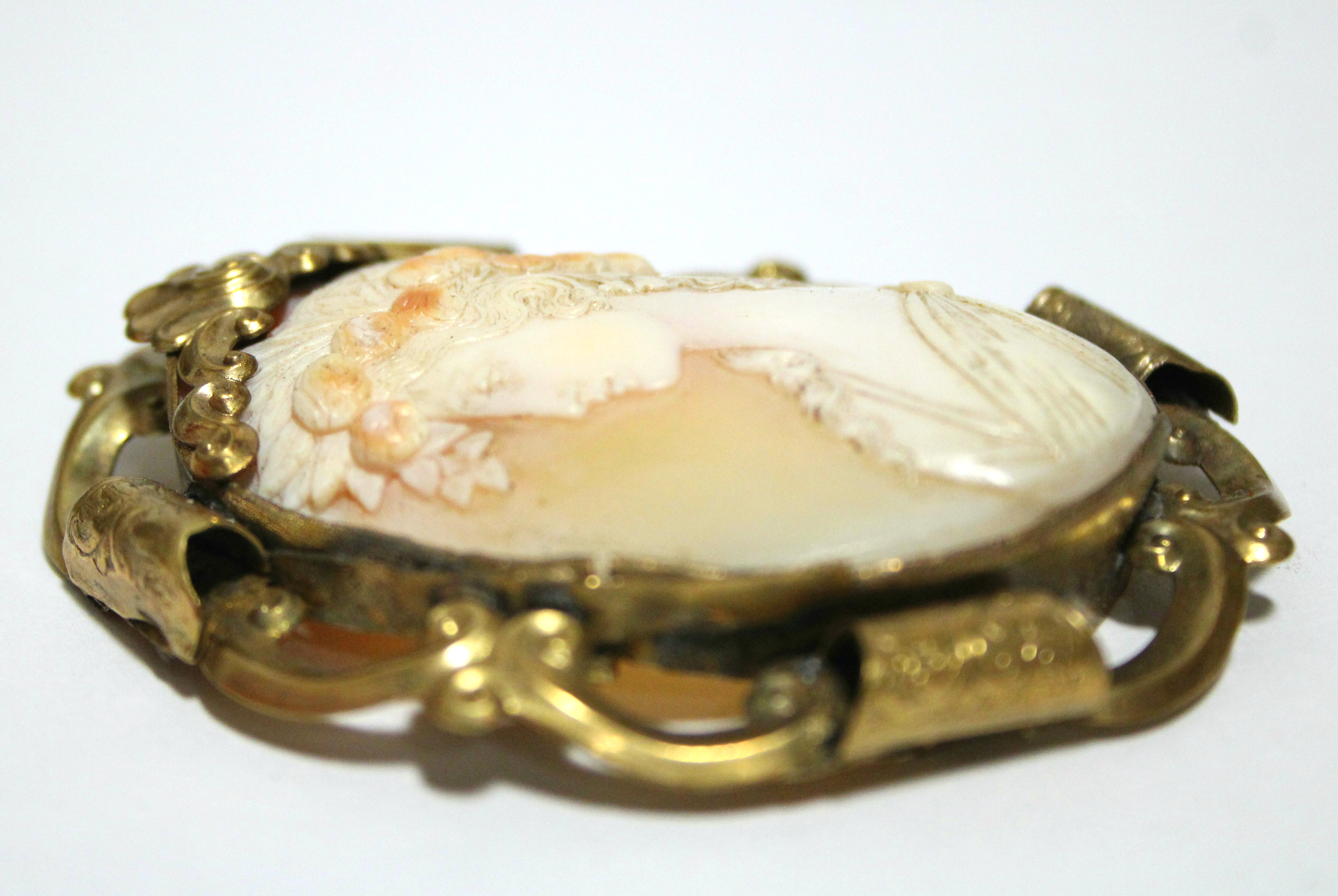 A 19th century carved shell oval cameo brooch depicting the Goddess Flora, 2” x 1½”; in pierced & - Image 3 of 3