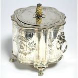 A late Victorian biscuit box of cylindrical form with serpentine sides, engraved floral borders &
