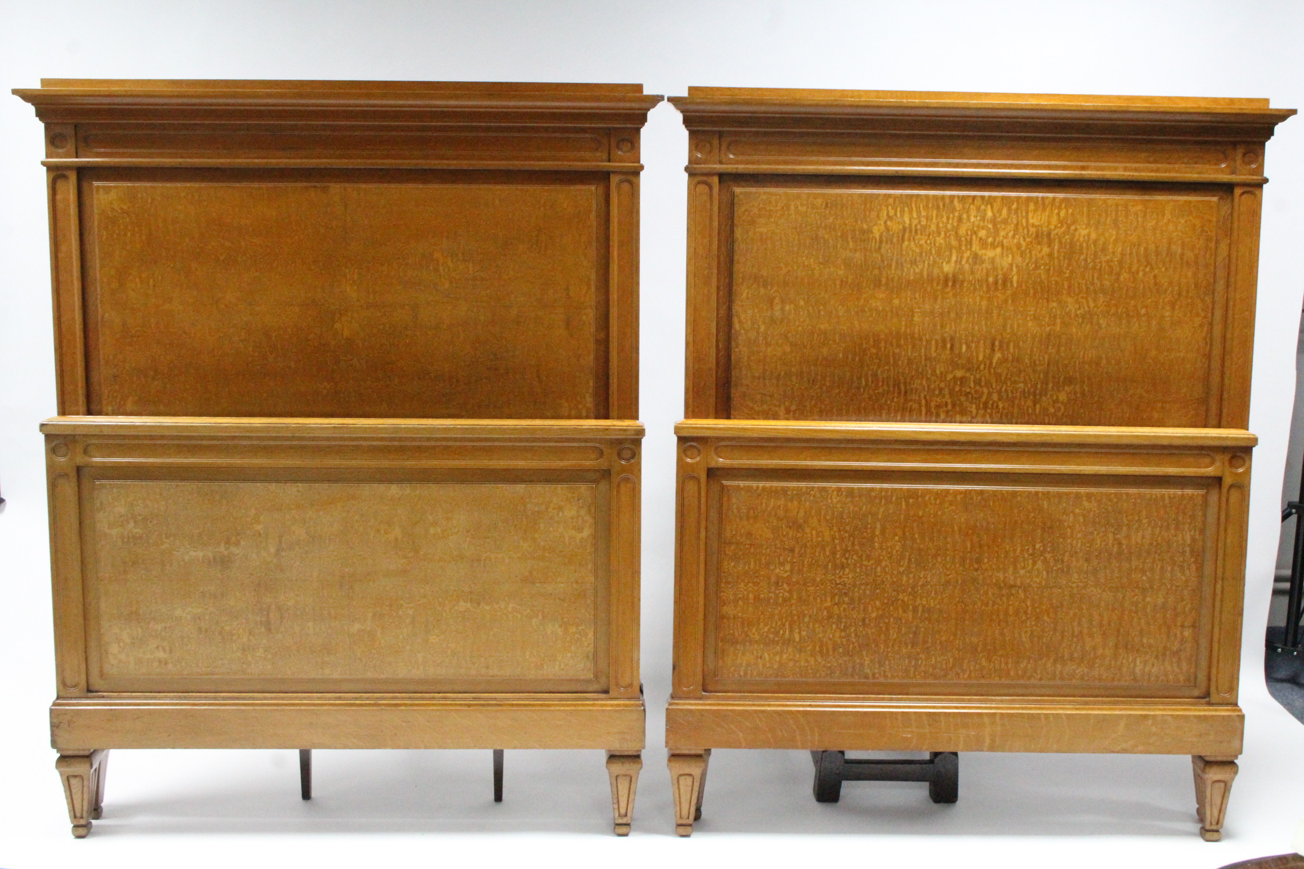 A pair of Edwardian oak & burr-elm single bedsteads with carved head & footboard, on square tapering - Image 2 of 3