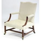 A George III mahogany Gainsborough armchair, the padded seat, back, & arms upholstered cream