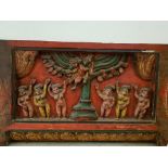 An Indian carved & polychrome painted door lintel decorated with figures & roundels; 43¼” wide x