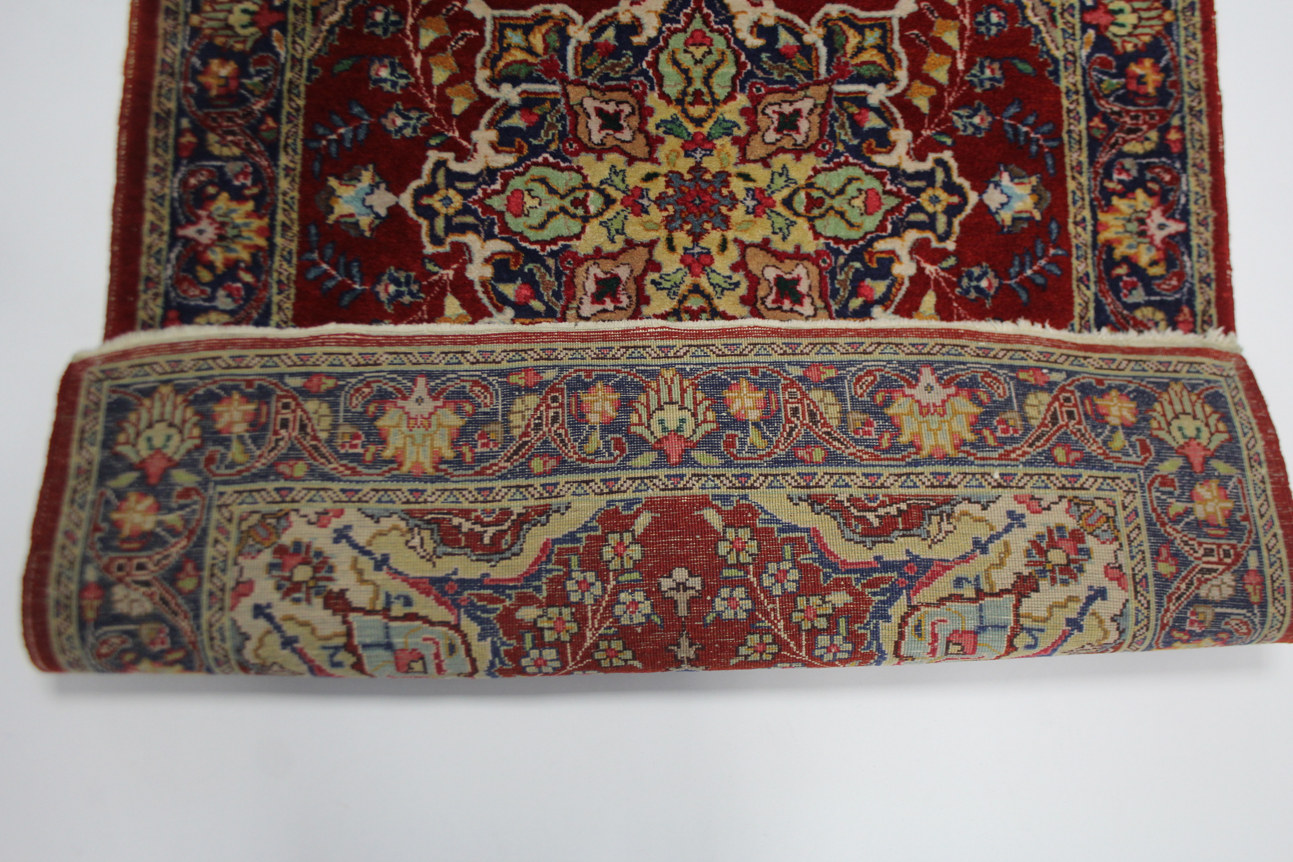 A Hamadan rug of crimson & blue ground, with central medallion surrounded by floral spandrels within - Image 2 of 2