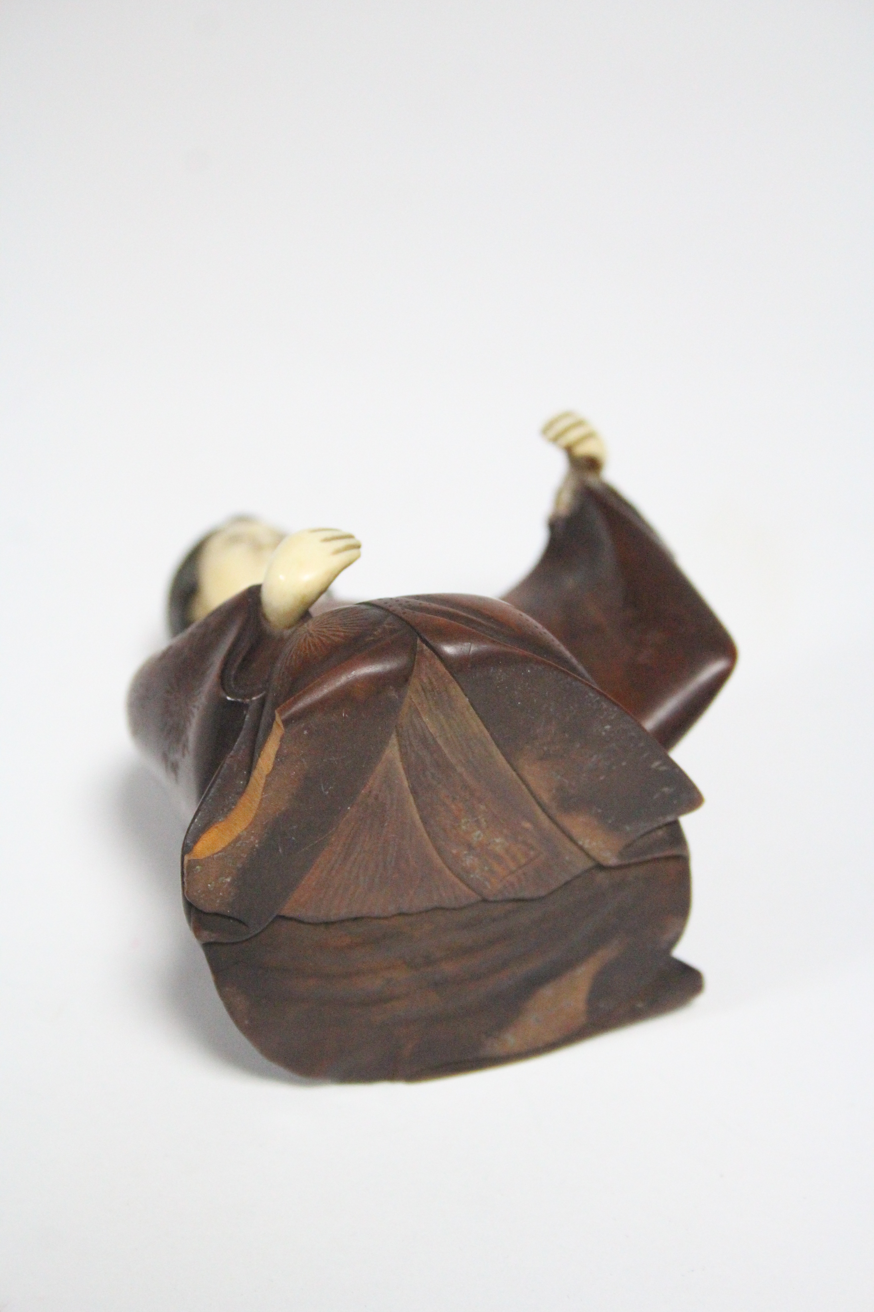 A late 19th century Japanese wood okimono of a kneeling Geisha, with ivory head & hands, signed on a - Image 5 of 7