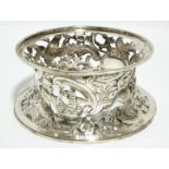 A GEORGE V POTATO or DISH RING in the traditional Irish style, the waisted sides pierced &