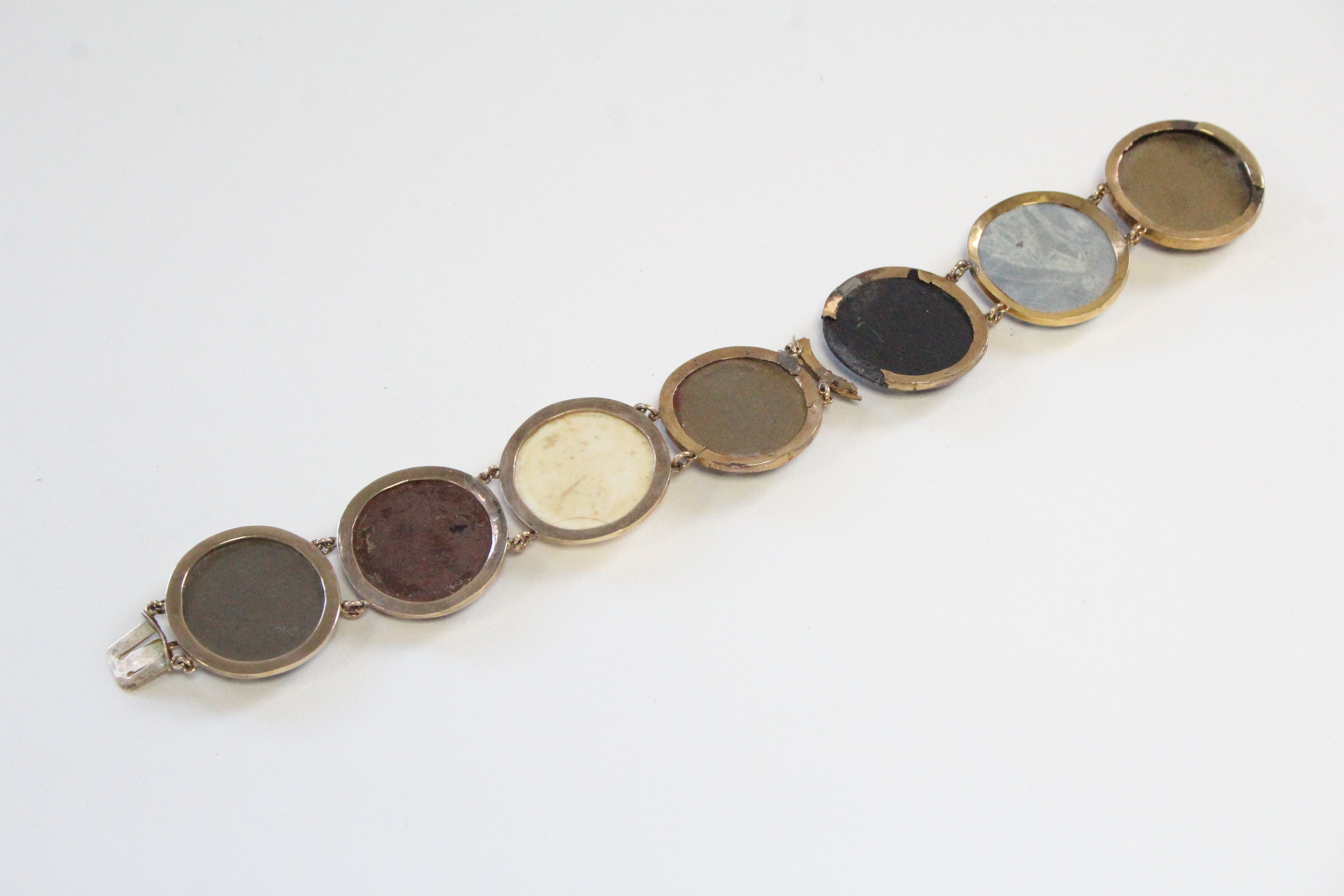 A 19th century GOLD & LAVA FLEXIBLE BRACELET comprising seven oval lava panels, each of a - Image 3 of 3
