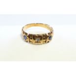 An 18ct. gold ring set diamond & two small sapphires.