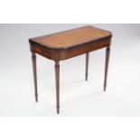 A late 18th century satinwood card table with amaranth crossbanding to the fold-over top, string