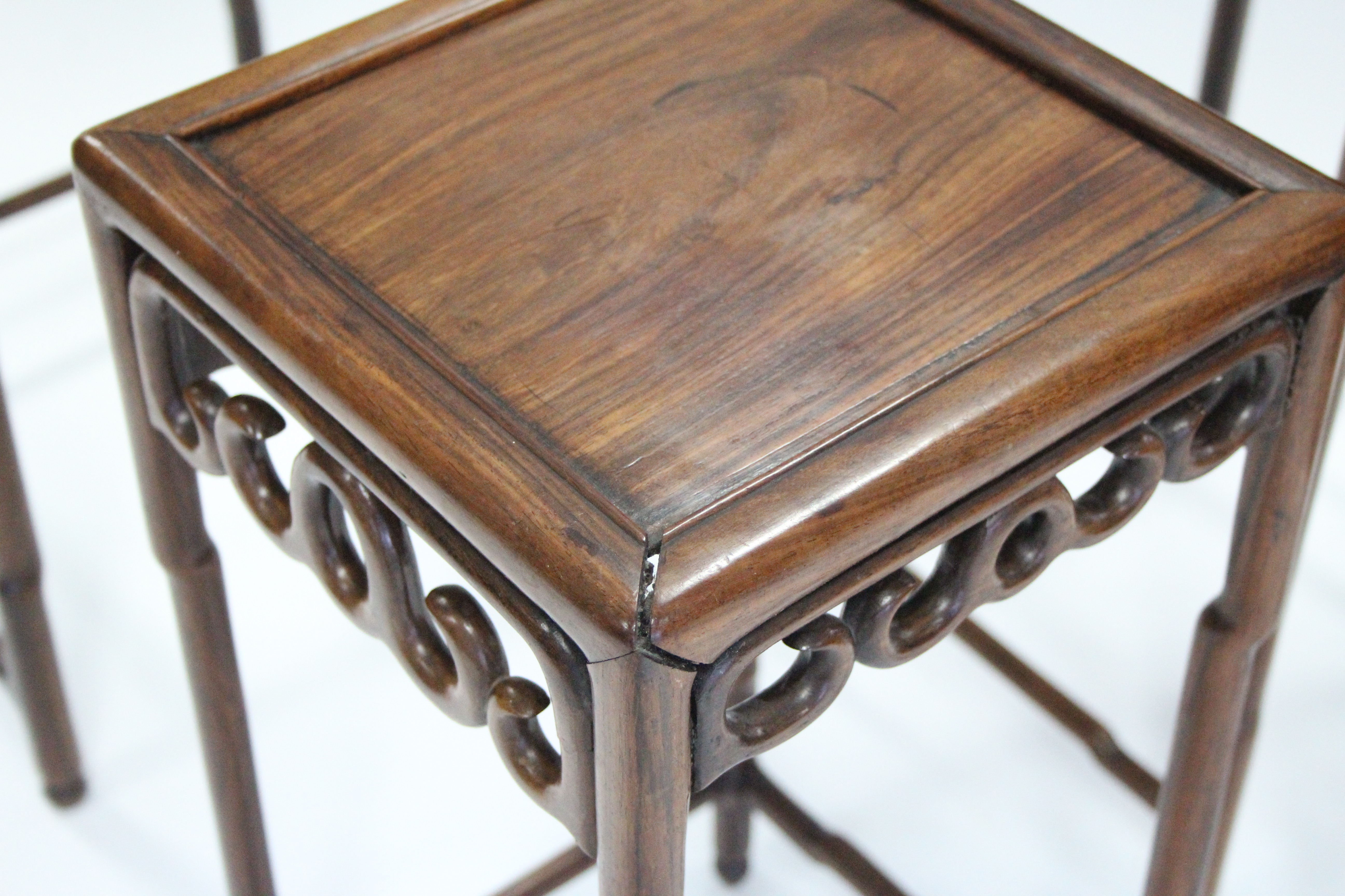 A nest of four Chinese hardwood occasional tables with pierced frieze, on faux-bamboo legs & - Image 4 of 6