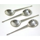 A set of four serving or soup spoons, each with baluster knop to the long flat tapered stem, &