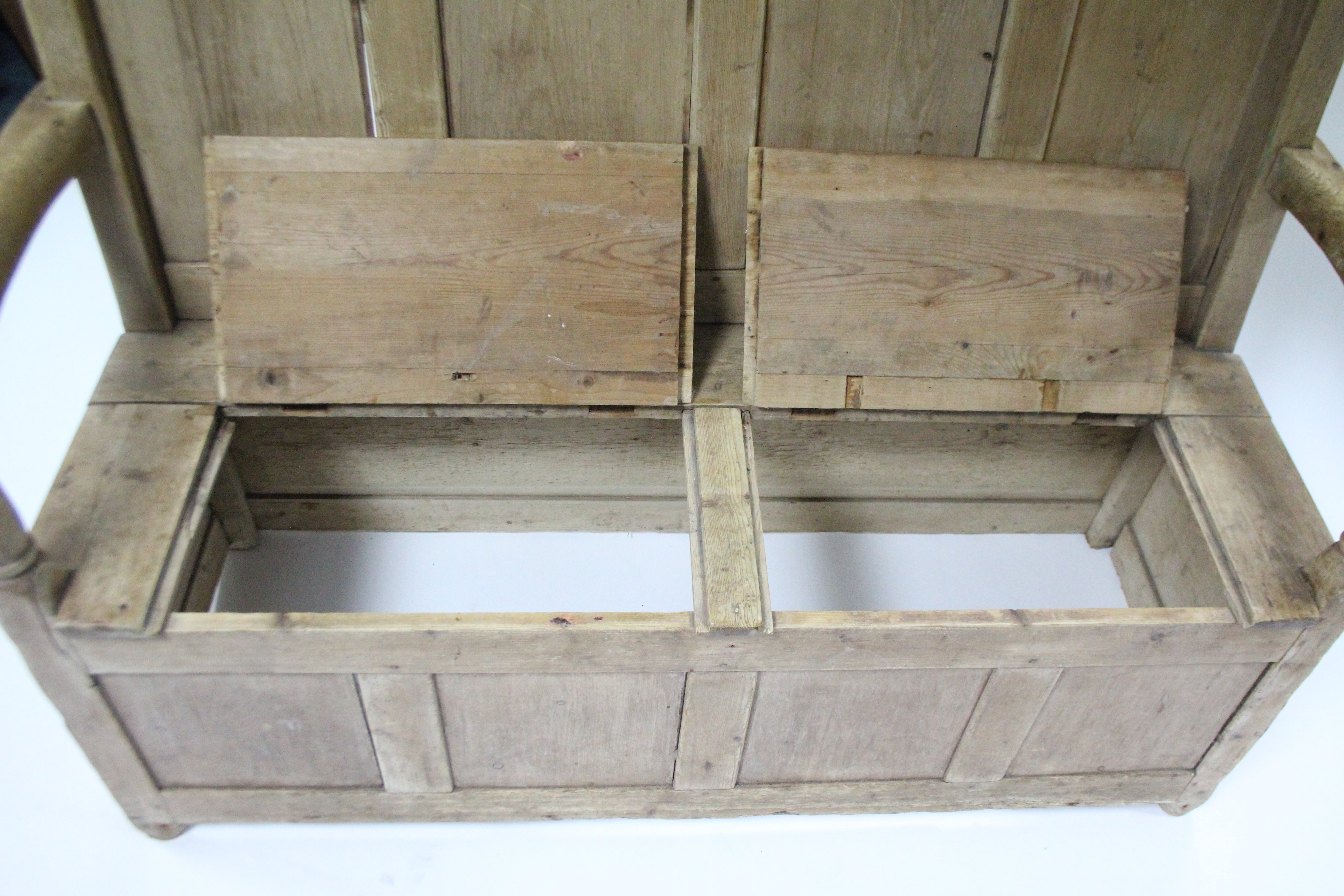 A 19th century pine box-seat settle with panelled back & open arms; 54” wide. - Image 3 of 4