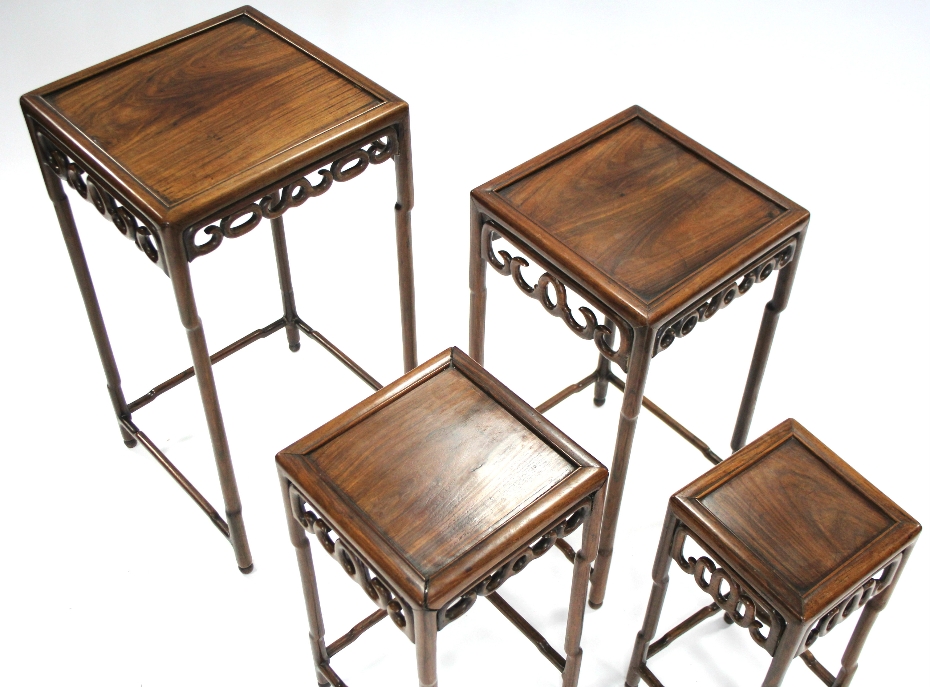 A nest of four Chinese hardwood occasional tables with pierced frieze, on faux-bamboo legs & - Image 3 of 6