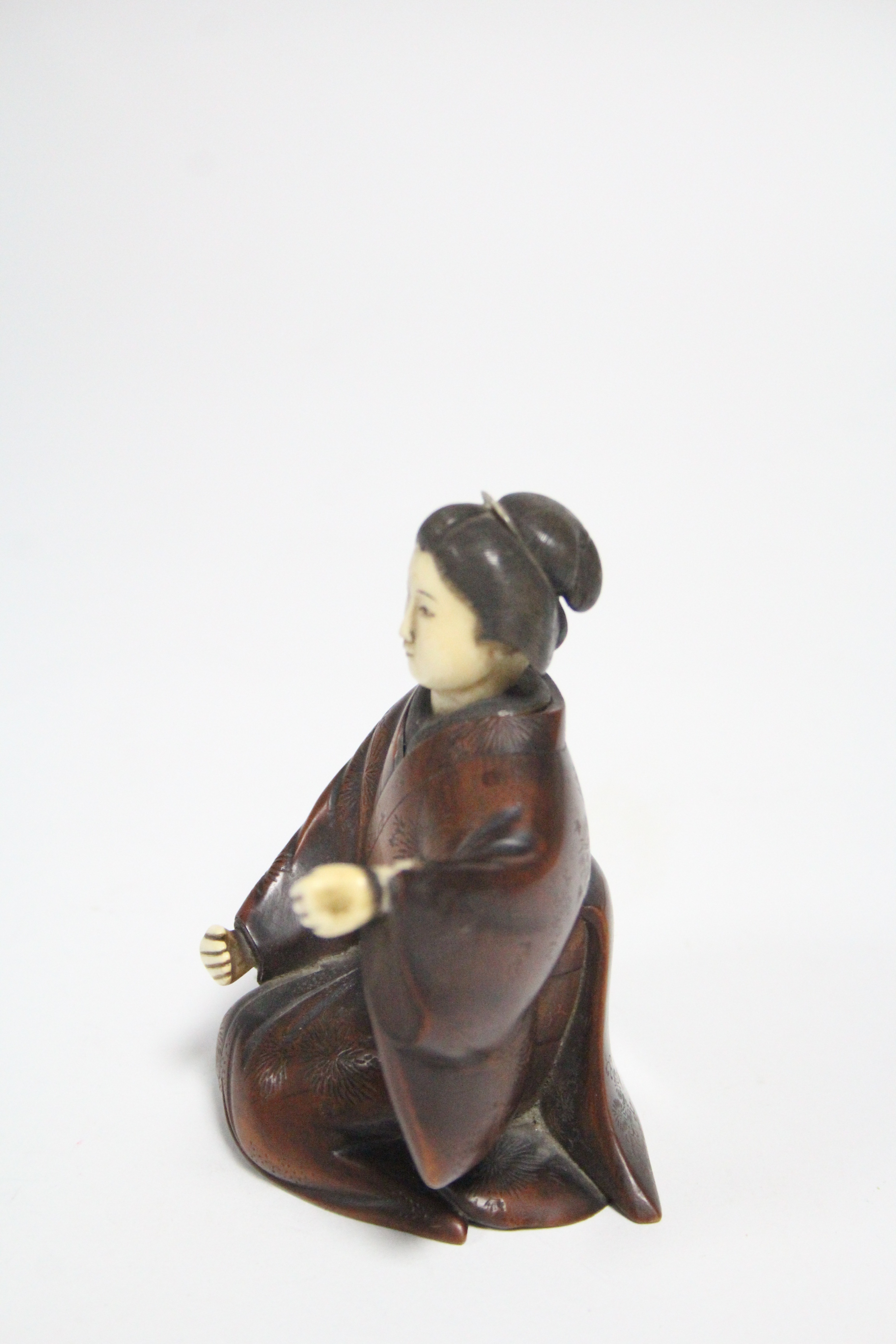 A late 19th century Japanese wood okimono of a kneeling Geisha, with ivory head & hands, signed on a - Image 4 of 7