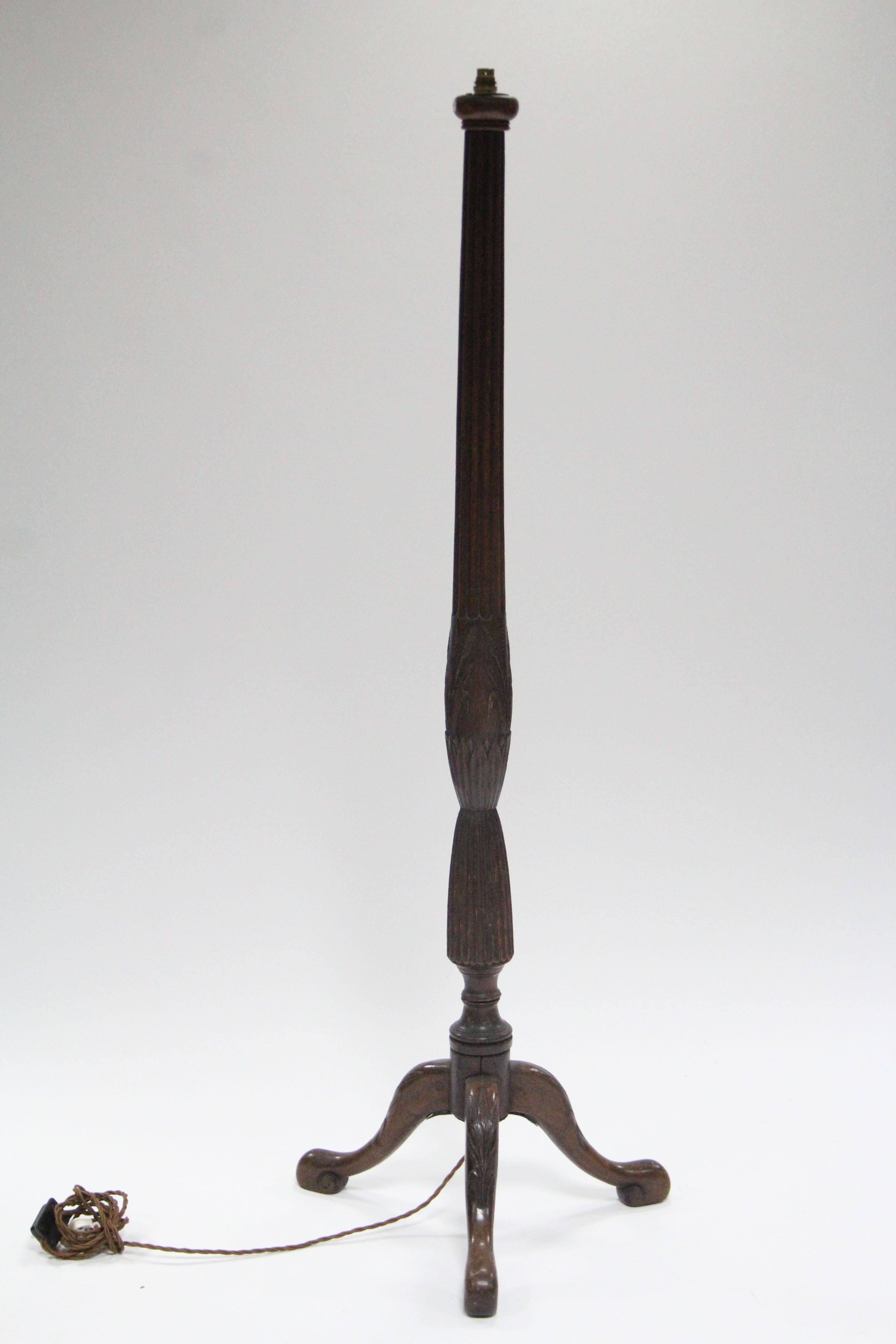 A mahogany standard lamp with turned, carved, & fluted column, on three cabriole legs; 62” high. (