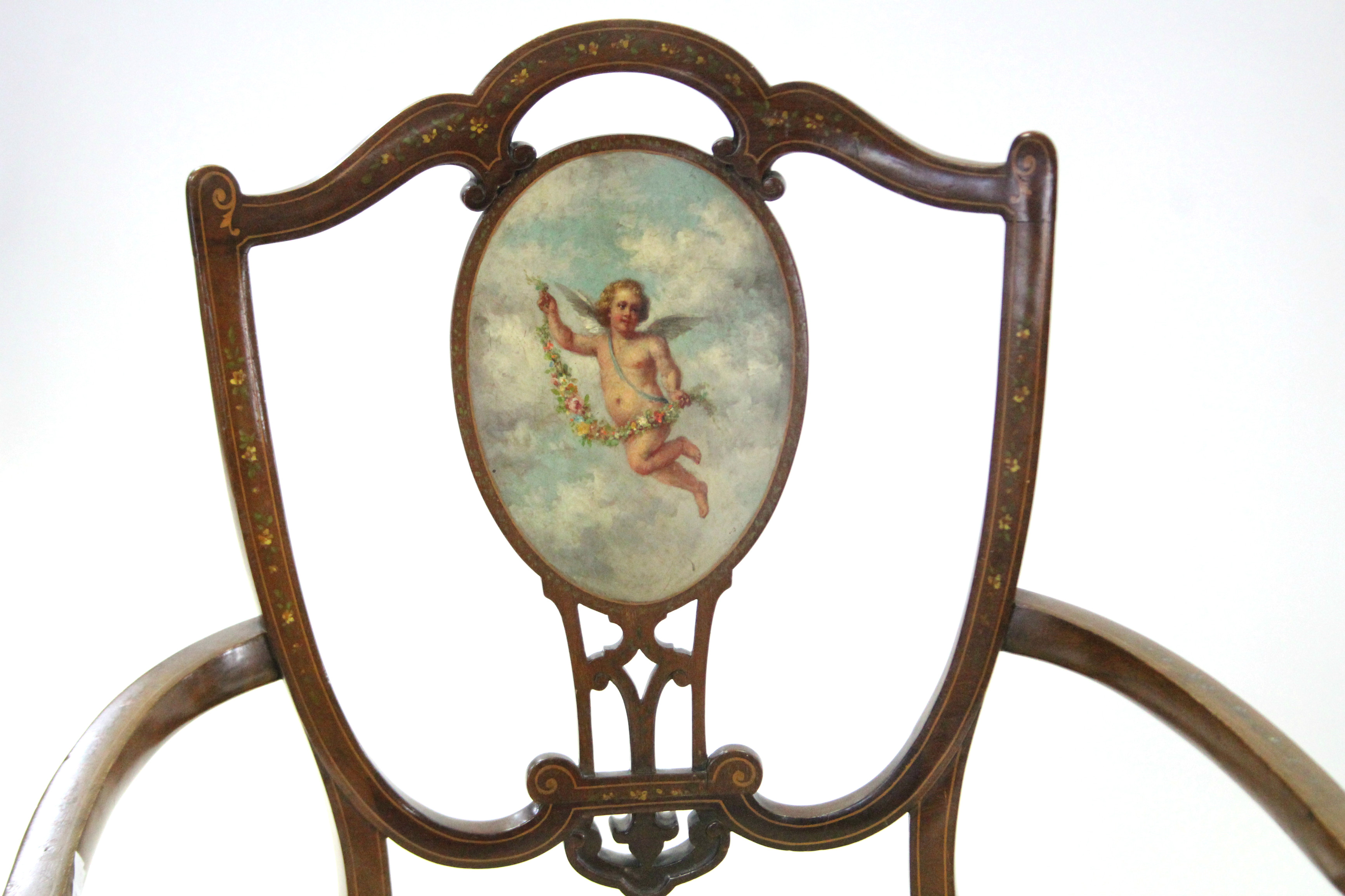 A Victorian small inlaid open armchair with padded seat, painted scene of a cherub holding a garland - Image 2 of 3