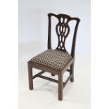 A Chippendale style mahogany child’s chair with shaped & pierced splat back, padded drop-in seat, on