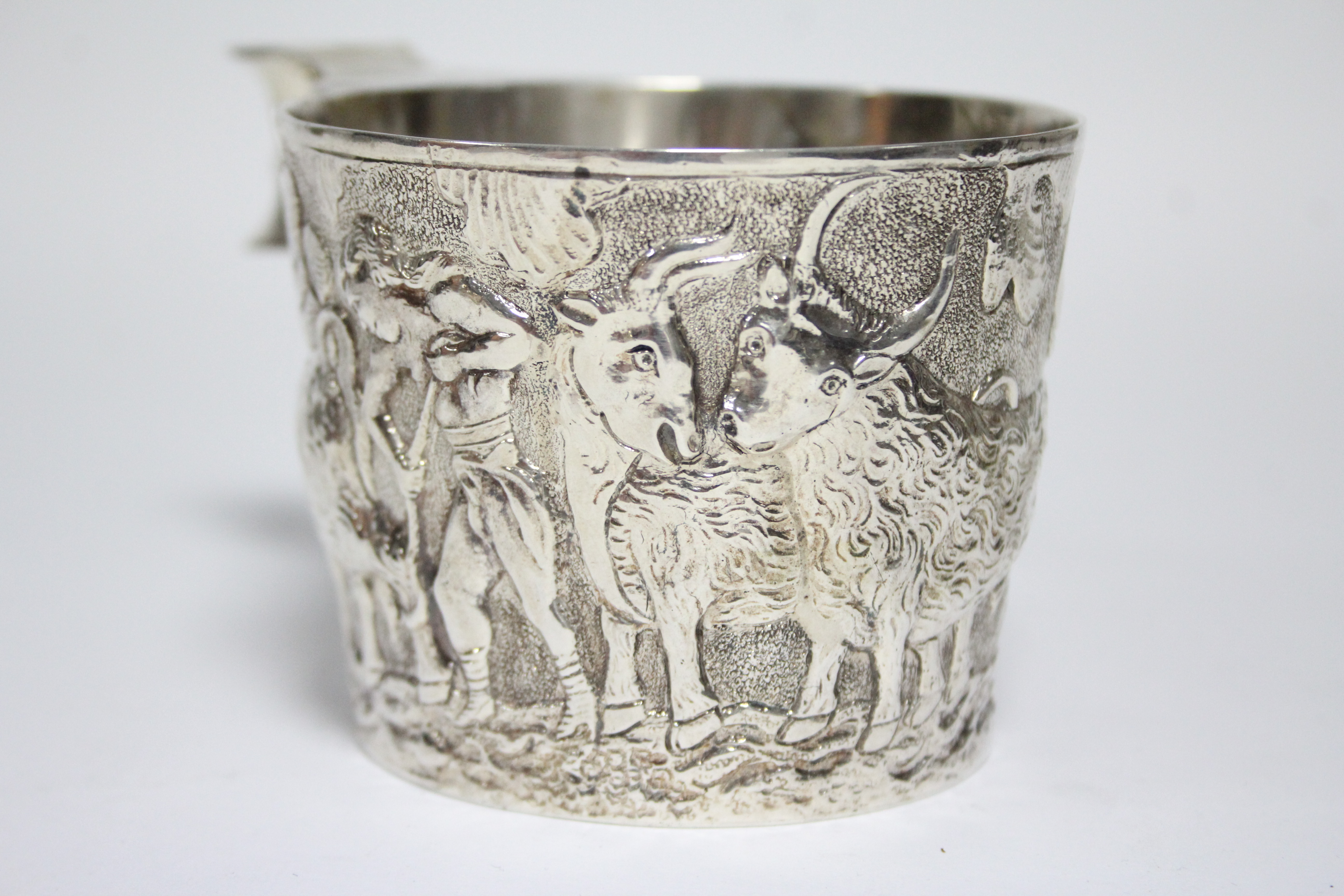 An Edwardian cup in the Etruscan style, of round slightly tapered form, embossed with a continuous - Image 2 of 6