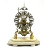 A VICTORIAN BRASS SKELETON CLOCK by WILLIAM JAMES TROBRIDGE of BATH, with pierced silvered chapter