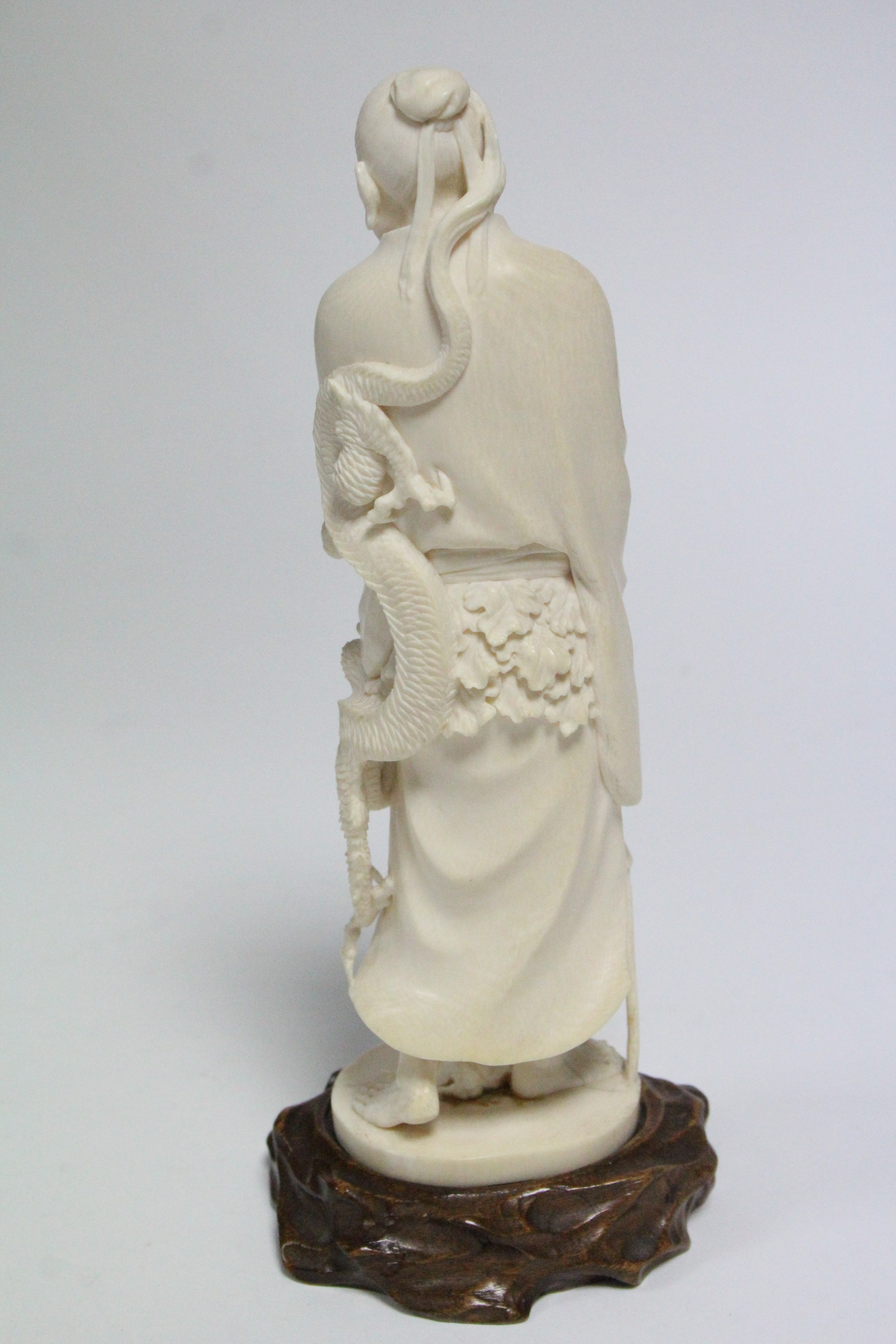 A late 19th century Japanese ivory okimono of a standing male scholar holding a scroll & a staff, - Image 3 of 5