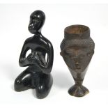 A Belgian Congo Bukuba carved wood drinking vessel in the form of a stylised human head, 6¾” high (