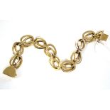 A continental yellow metal flexible bracelet of double oval links, 8” long (71 gm).